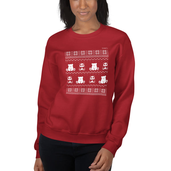 Winter Holiday Sweater design by P.M.B.Q. Studios. This design simulates a wintry knit pattern and features the Polo Cub character and his adorable panda friend. The design is white printed on a unisex red crewneck sweatshirt. The sweatshirt is worn by a female model.